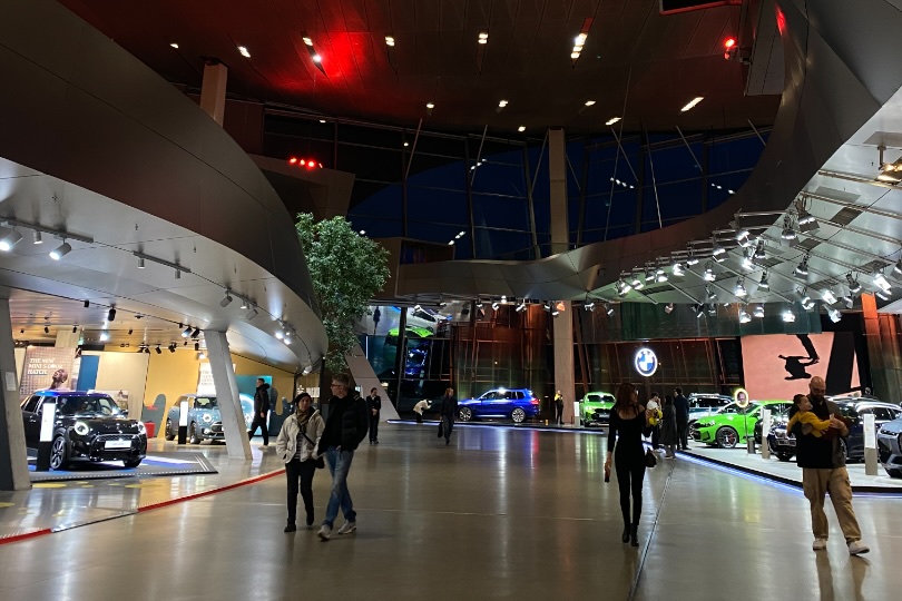 Inside BMW Welt, the curved hall with cars on display
